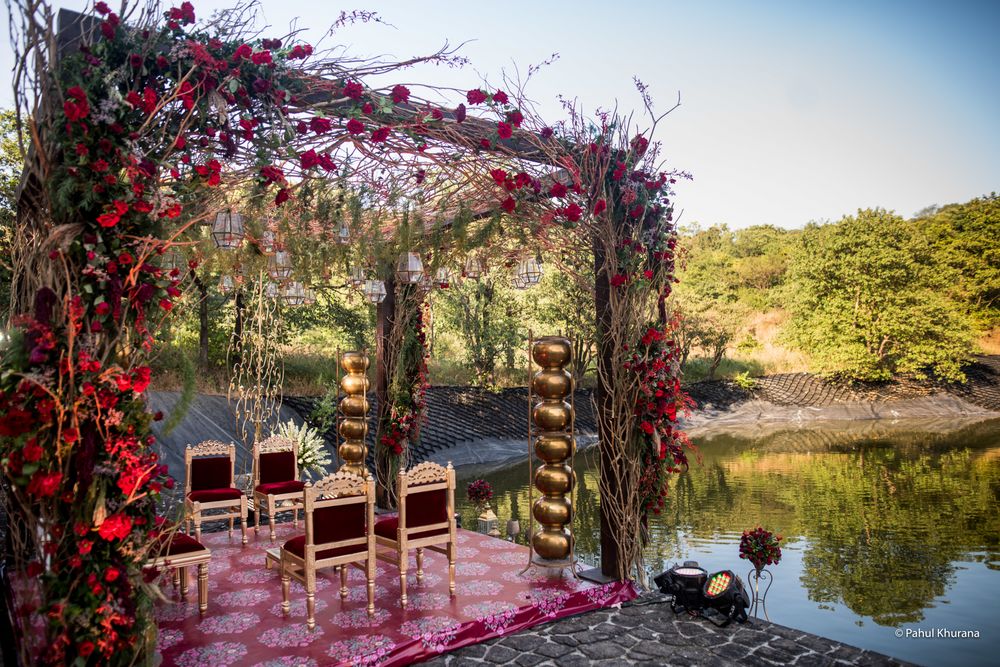 Photo of A beautiful floral mandap by the lake