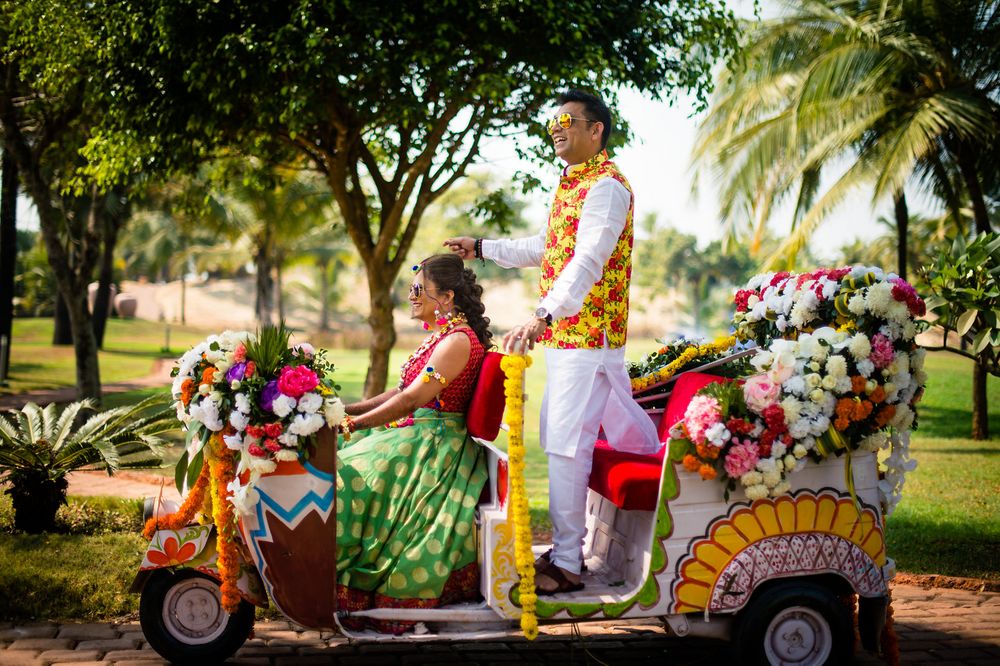 Photo of Bride and groom entering in decorated auto