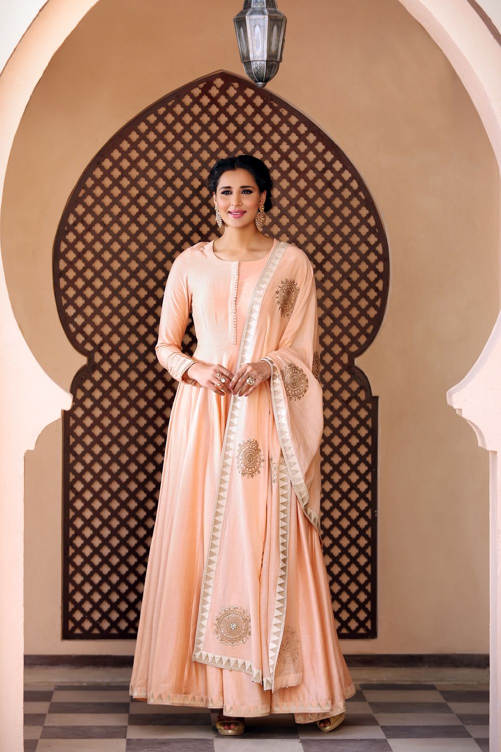 Photo of Peach anarkali suit with gold work