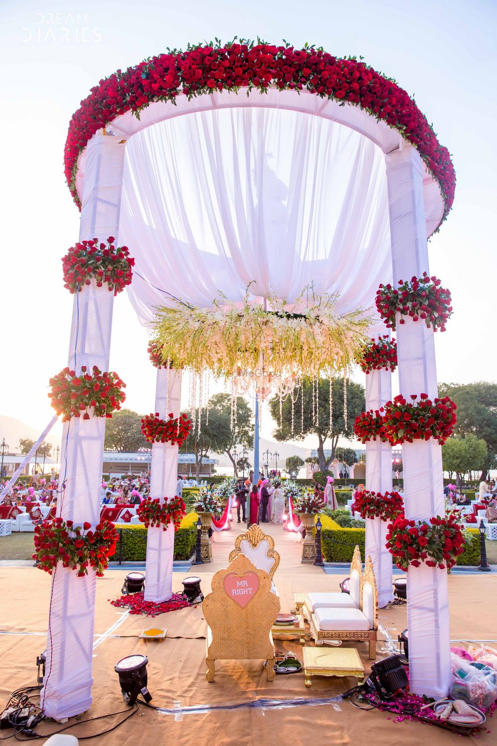 Photo of Red and white theme floral round mandap