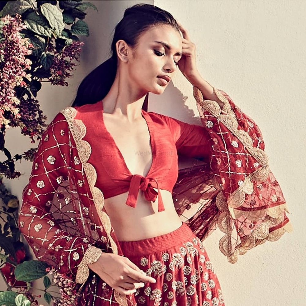 Photo of modern red bridal blouse with unique tie up blouse