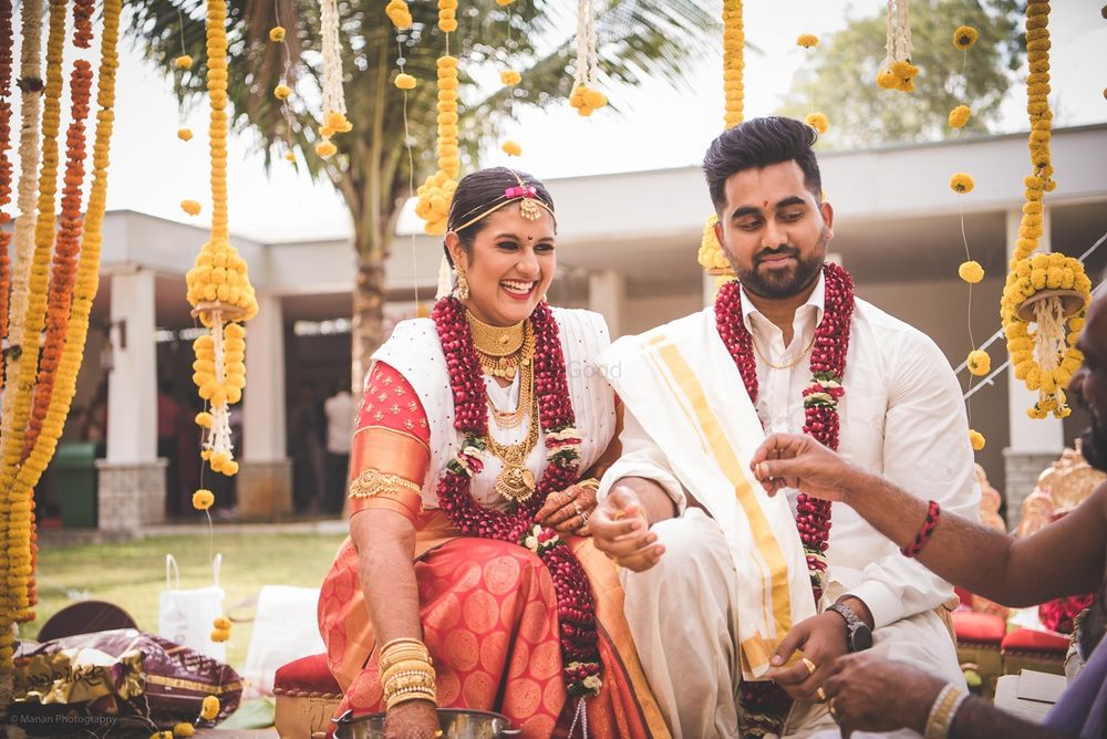 Photo of Bride & groom getting married & smiling wide throughout