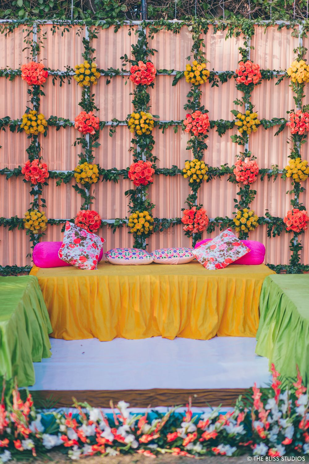 Photo of Seating arrangement with a floral backdrop.