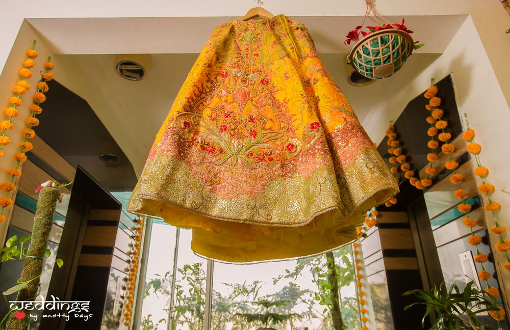 Photo of Yellow Bridal Lehenga on a Hanger