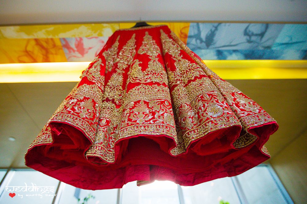 Photo of Red and Gold Hanging Bridal Lehenga