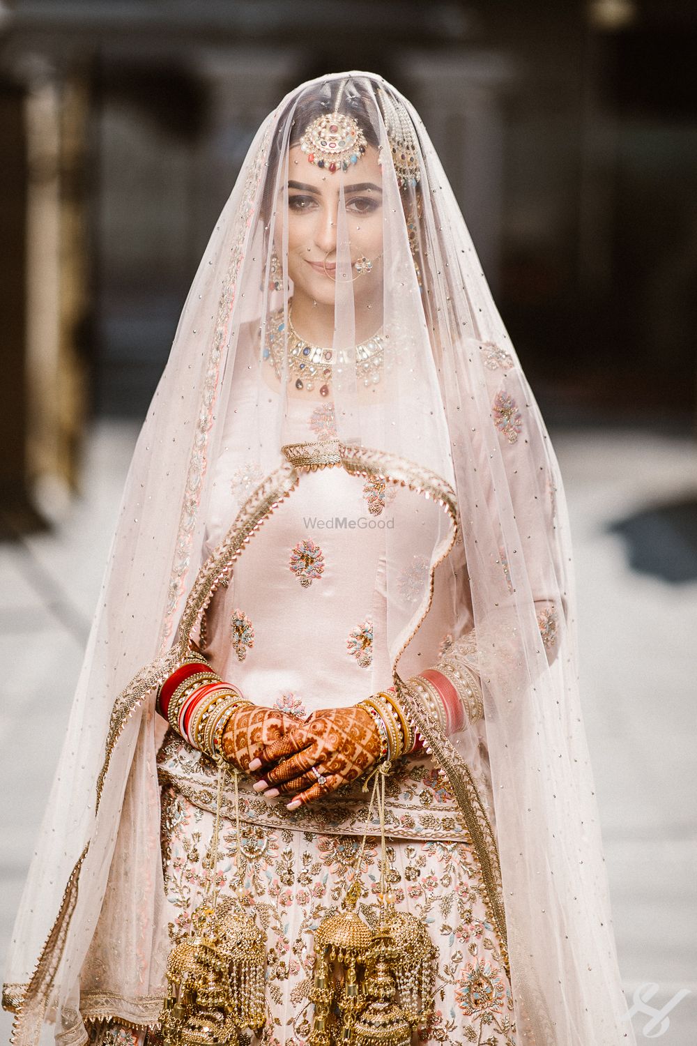 Photo of Bride under a veil shot