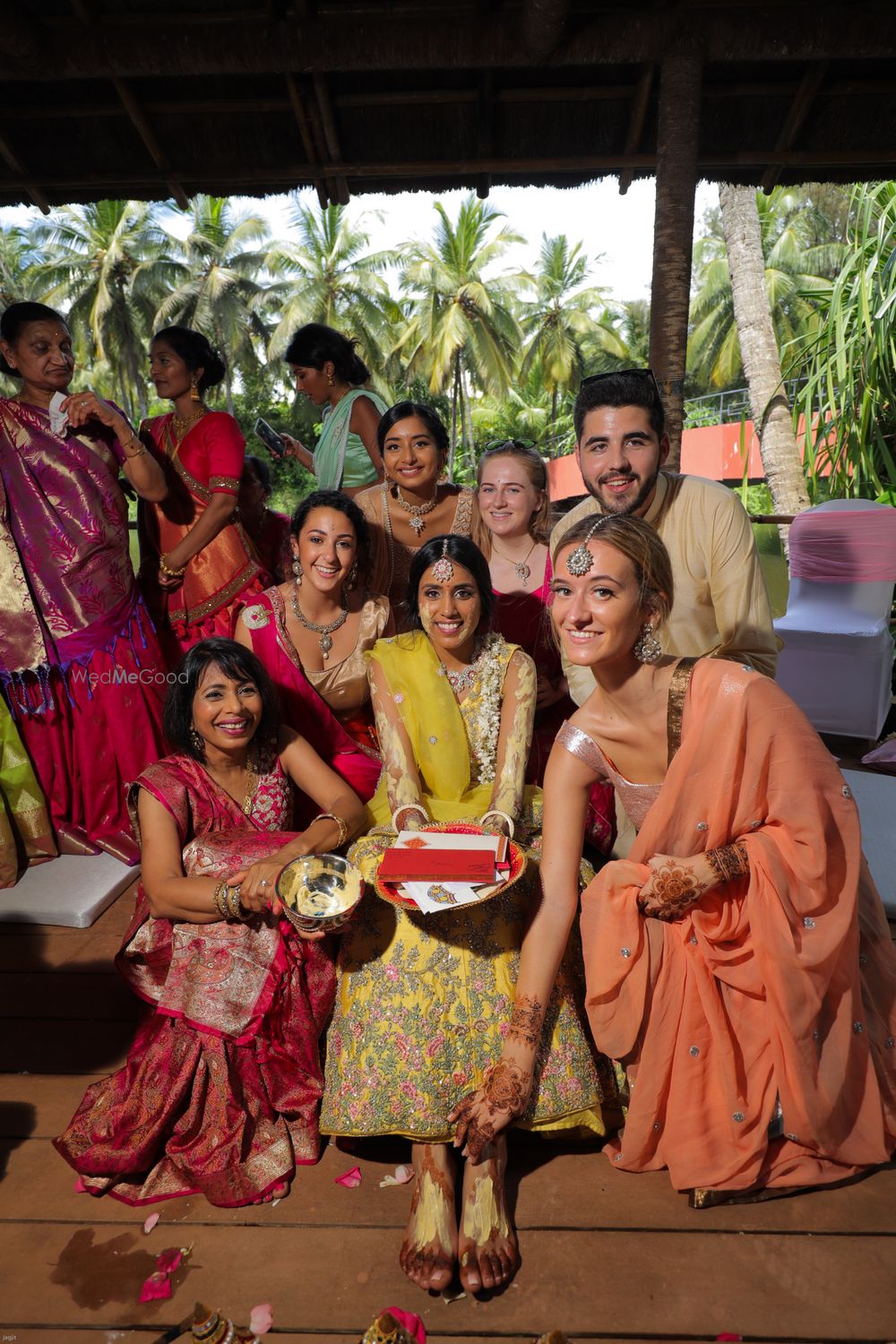 Photo of A fun haldi picture of a bride with her friends.