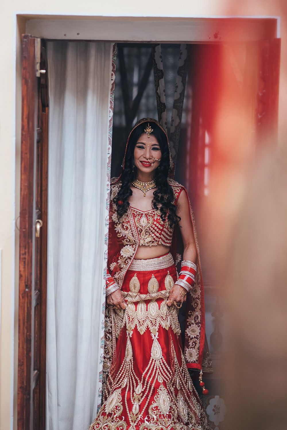 Photo of Red Bridal Lehenga with Gold Embroidery