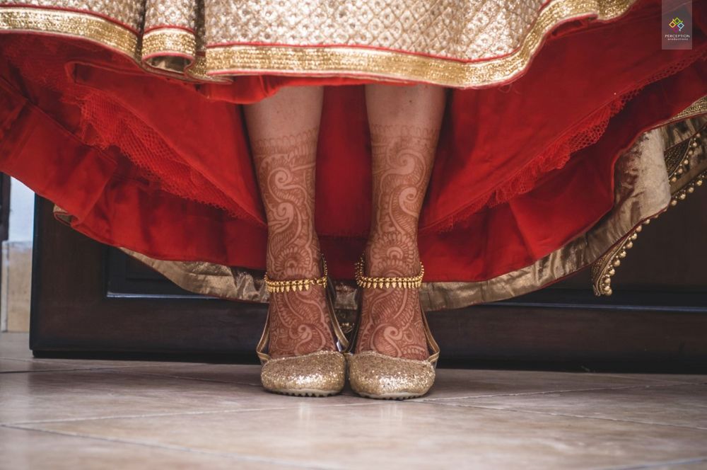 Photo of Bride Wearing Gold Shoes and Anklets
