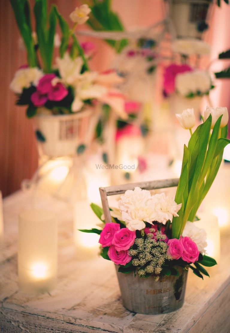 Photo of Floral arrangement in rustic tin basket