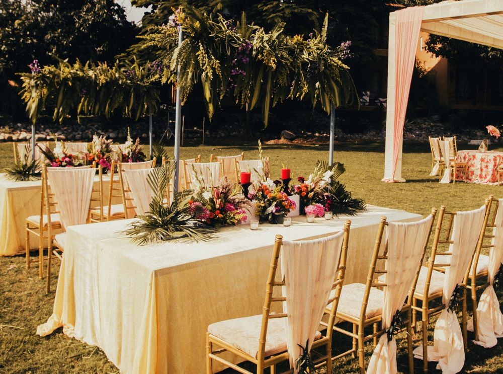 Photo of long table seating idea for an intimate wedding with florals