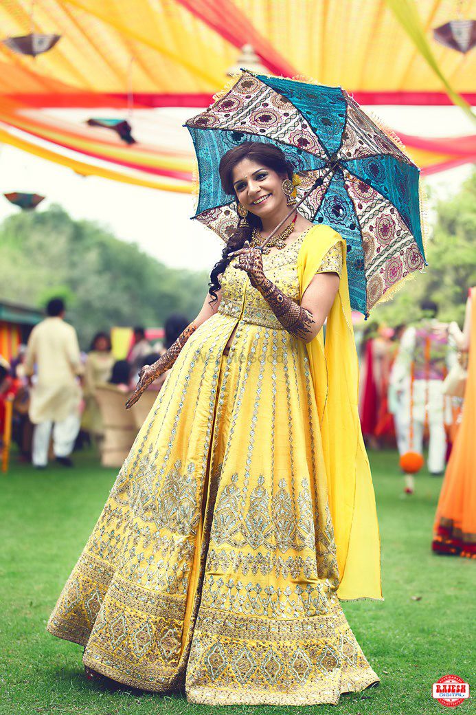 Photo of Light Yellow and Gold Anarkali Bride with Umbrella