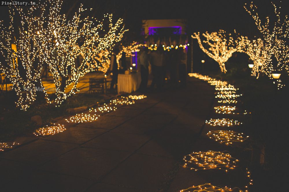 Photo of fairy lit wedding entrance decor