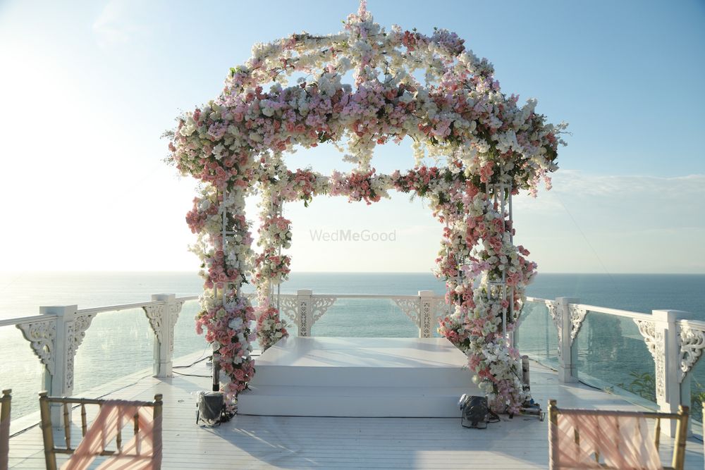 Photo of A beautiful round mandap with floral decor.