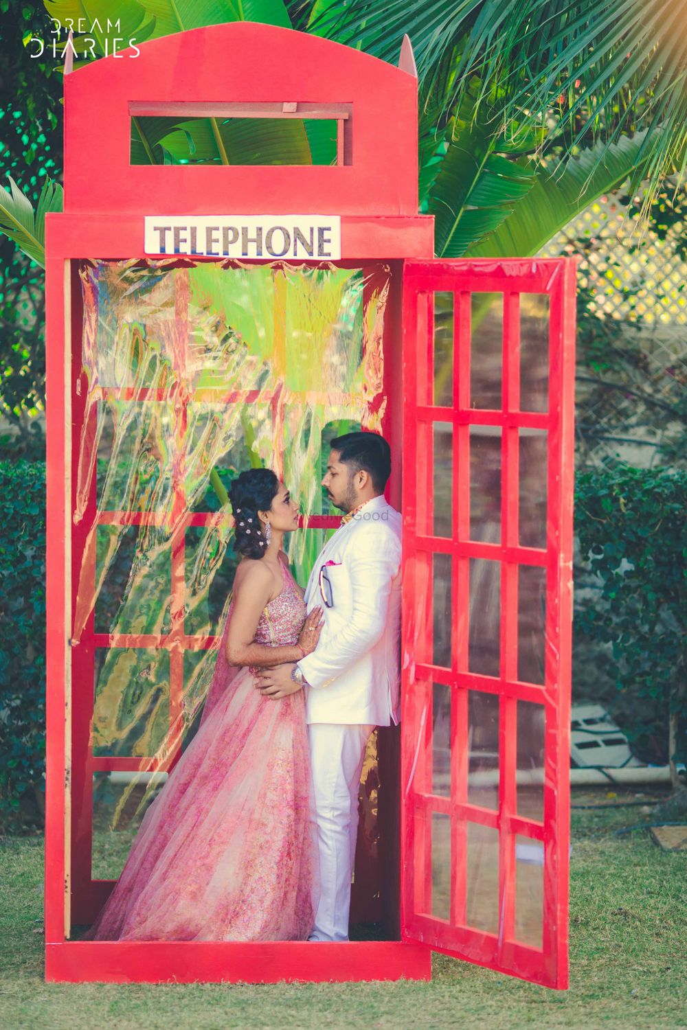 Photo of Couple Hugging in Telephone Photobooth