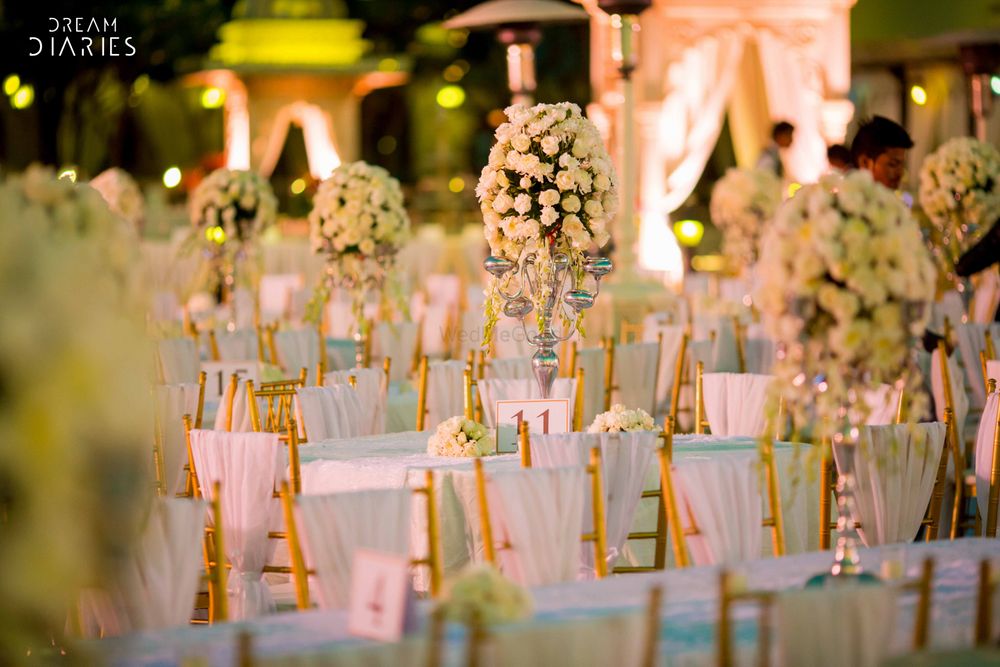 Photo of White and Gold Seating with Floral Centerpiece