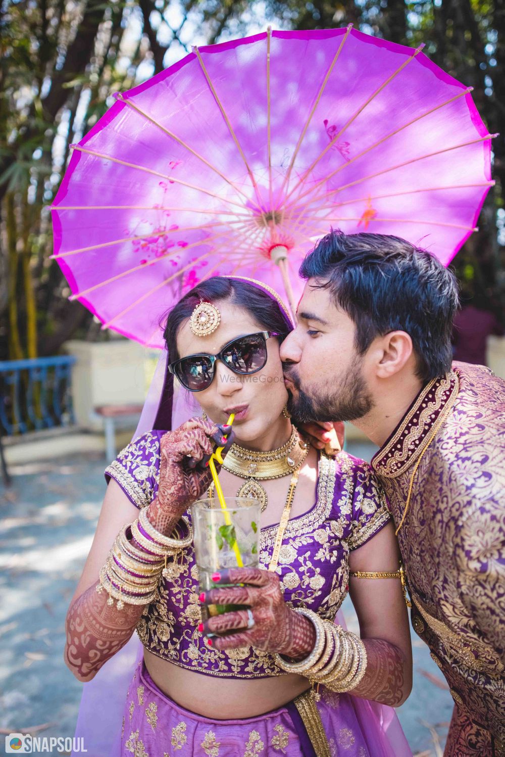 Photo of Cool couple portrait with bride drinking alcohol
