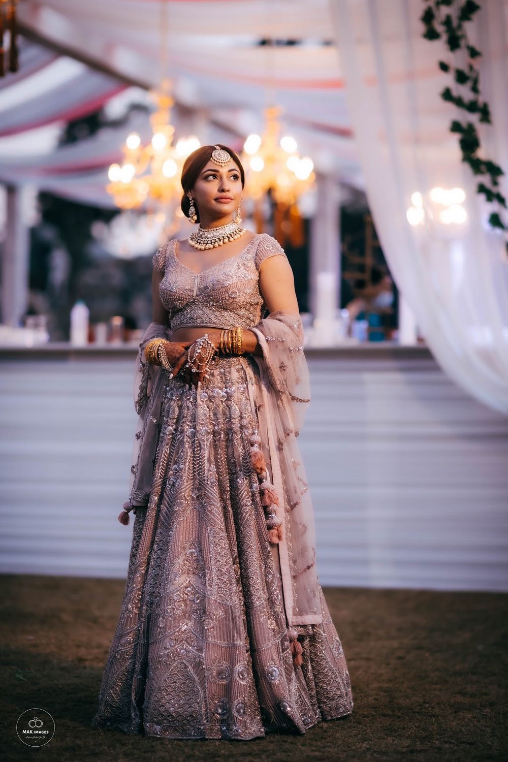 Photo of Candid click of a bride wearing a silver lehenga.