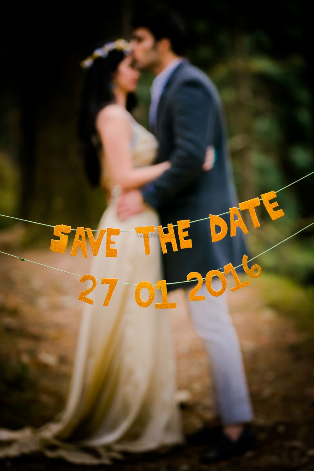 Photo of Save the Date with String and Letter Cut Outs
