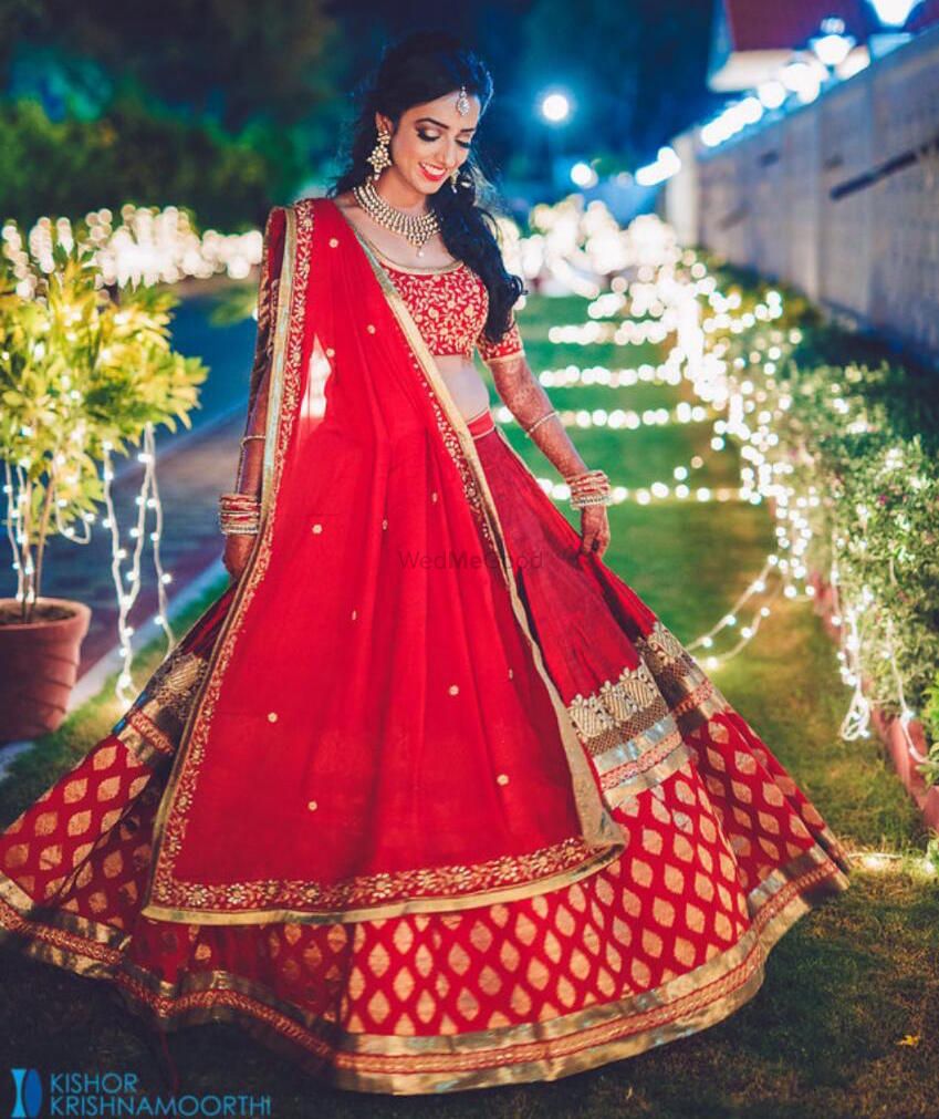 Photo of Red and Gold Brocade Twirling Lehenga