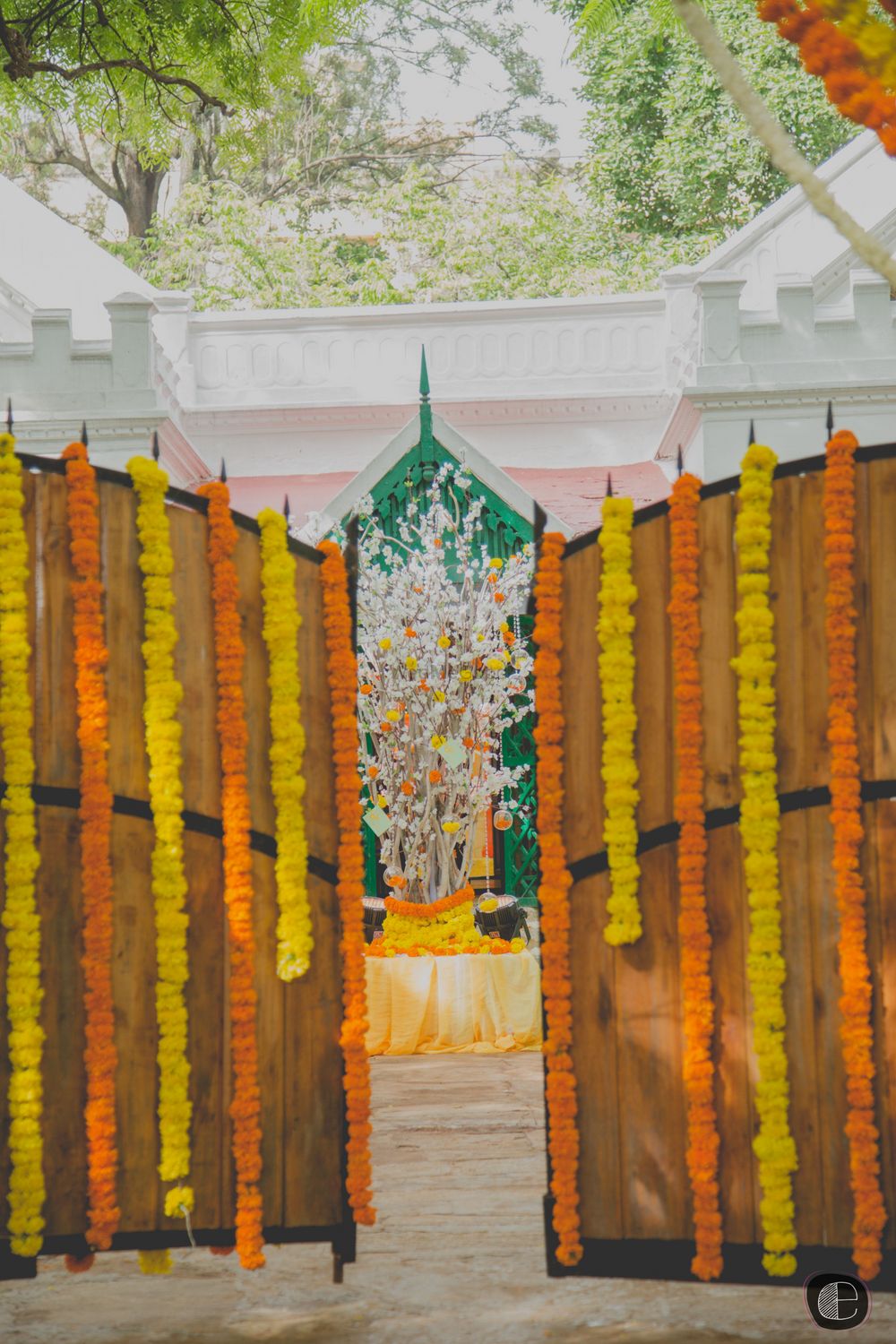 Photo of Orange and Yellow Genda Phool Entrance Decor
