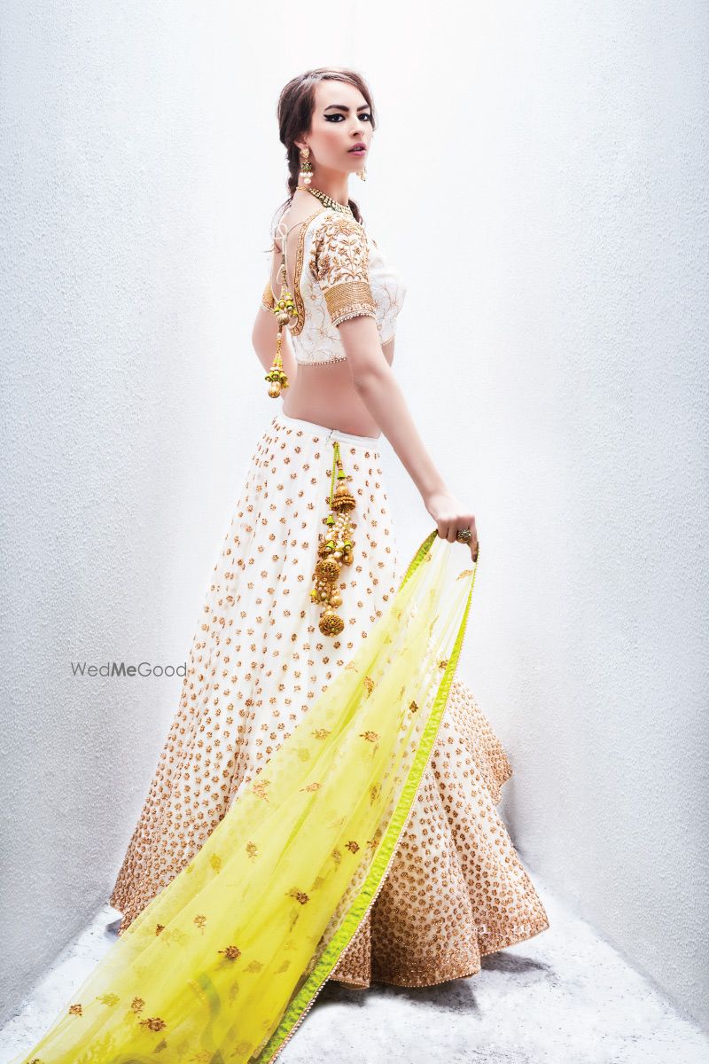 Photo of White and Gold Lehenga with Yellow Dupatta