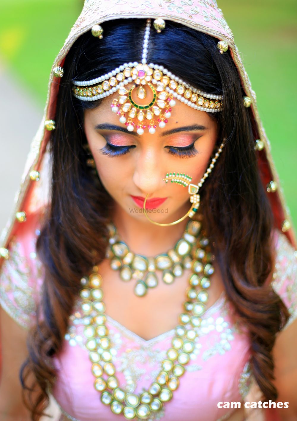 Photo of Bride wearing statement Kundan jewellery and Nath
