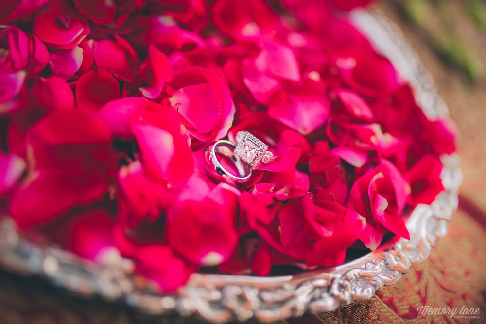 Photo of Solitaire Engagement Ring on Rose Petal