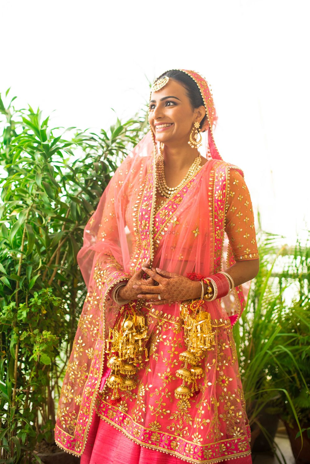 Photo of Pastel Pink Shaded Lehenga with Gold Kaleere