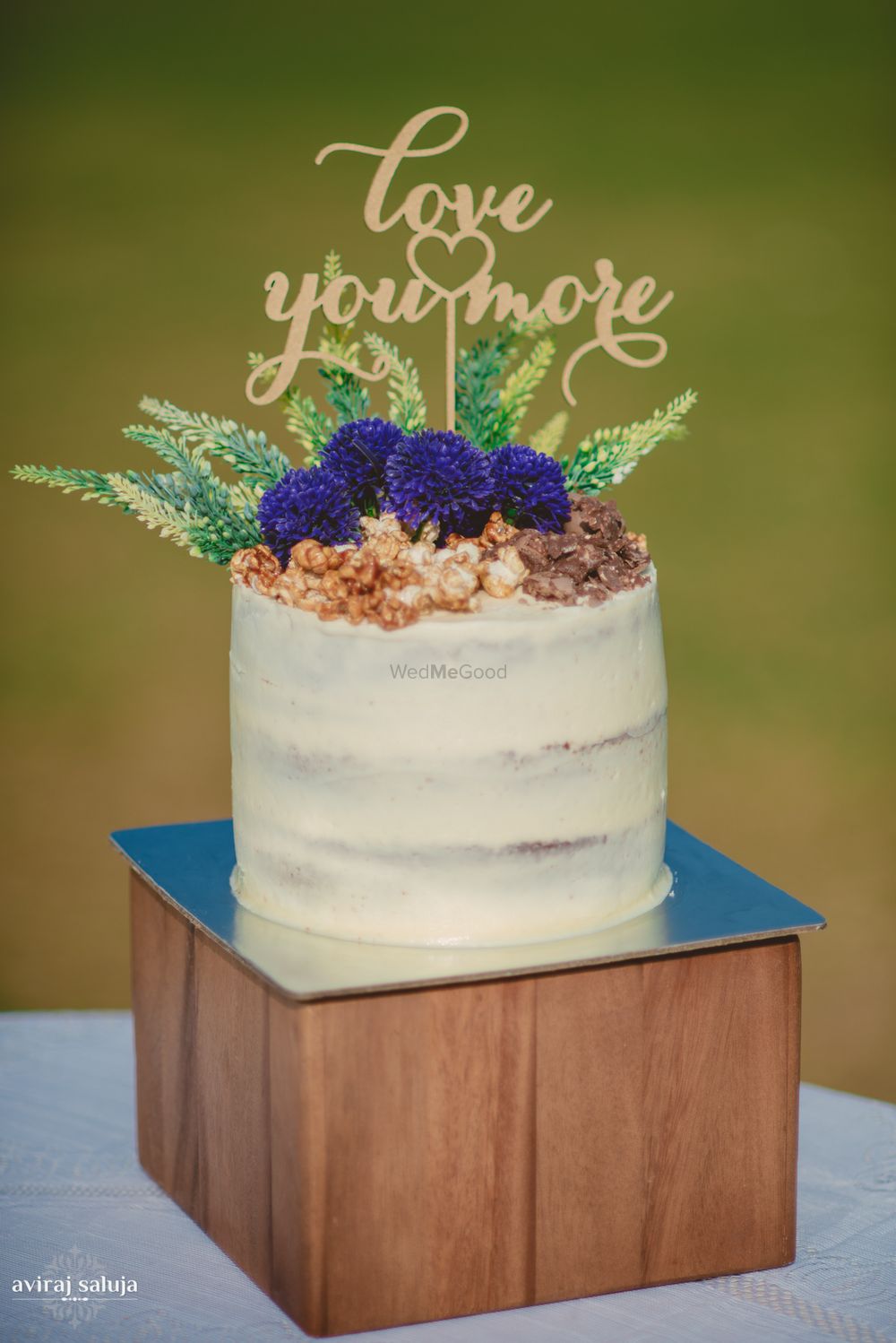 Photo of White Wedding Cake with Nuts and Blueberry