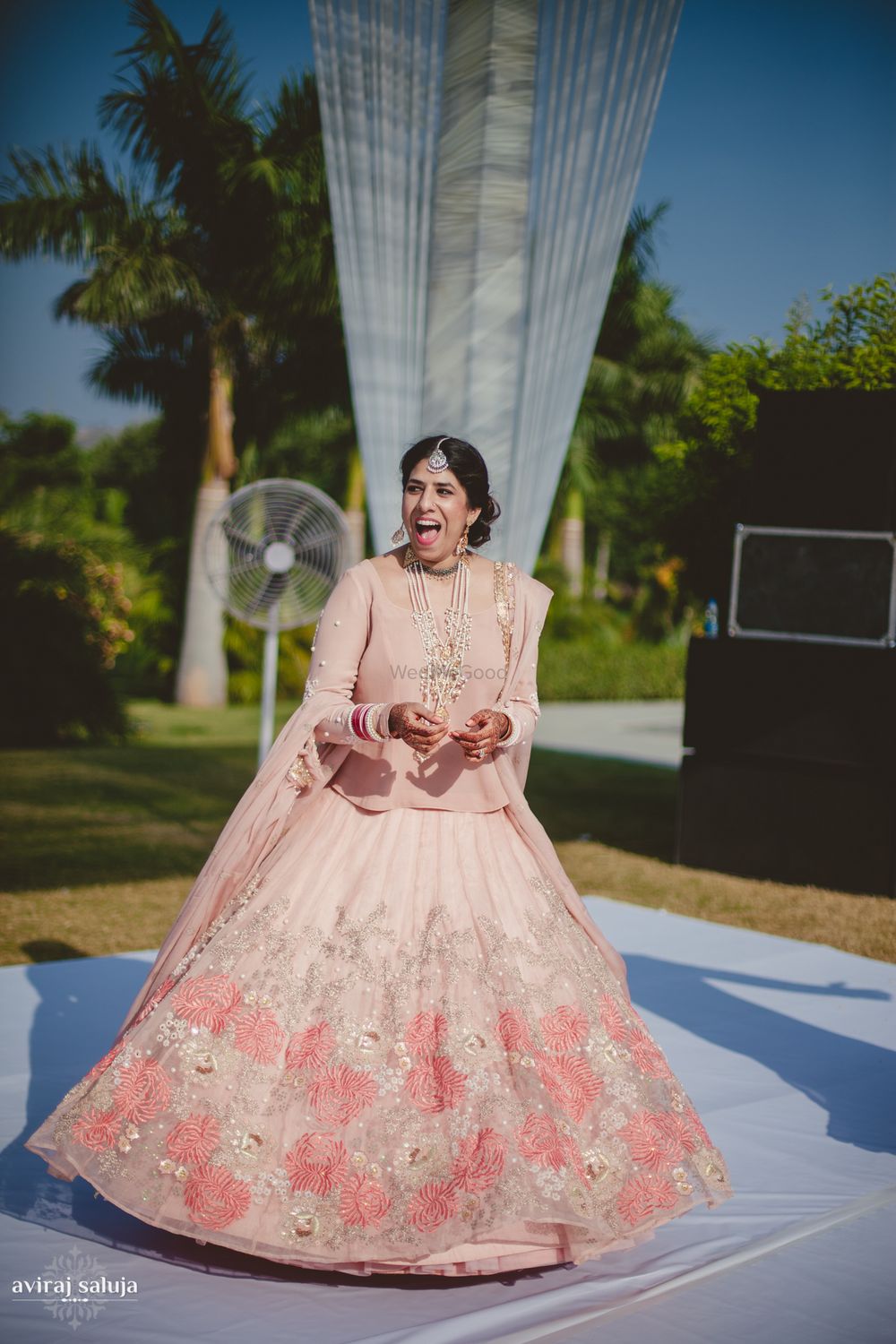 Photo of Pastel Pink Twirling Bridal Lehenag
