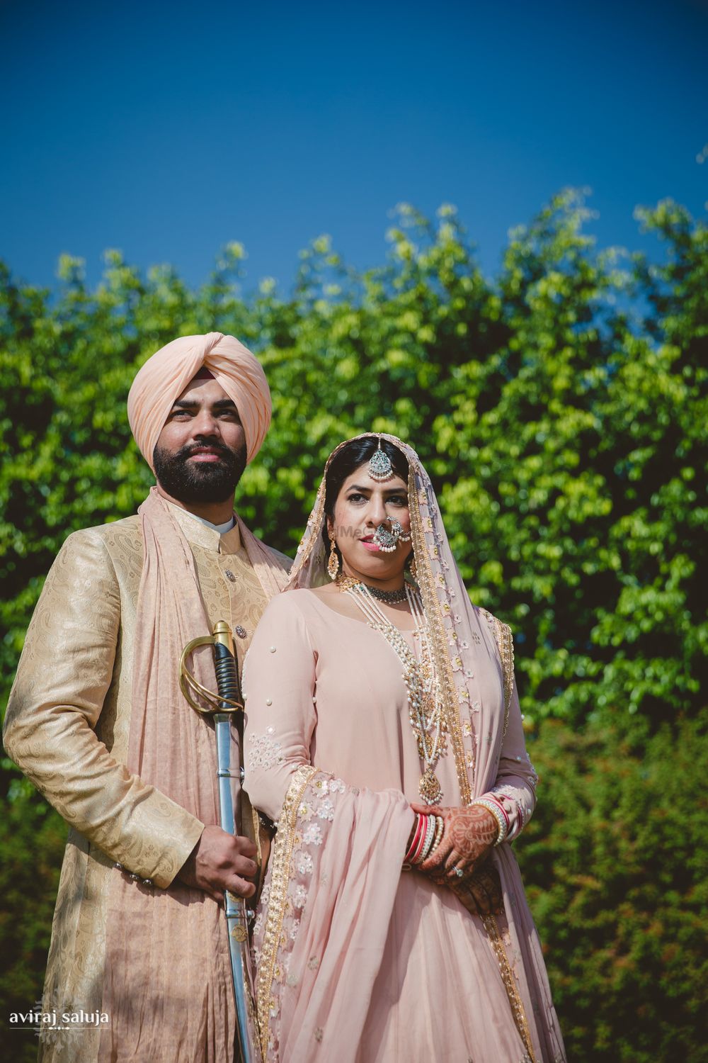 Photo of Pastel Pink Sikh Couple Shot