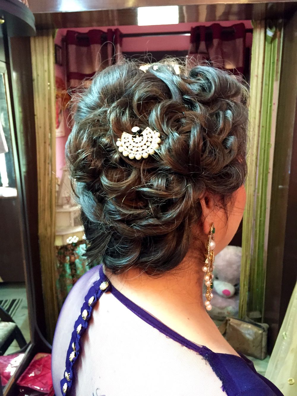 Photo of Bun with tied up curls for sangeet or engagement