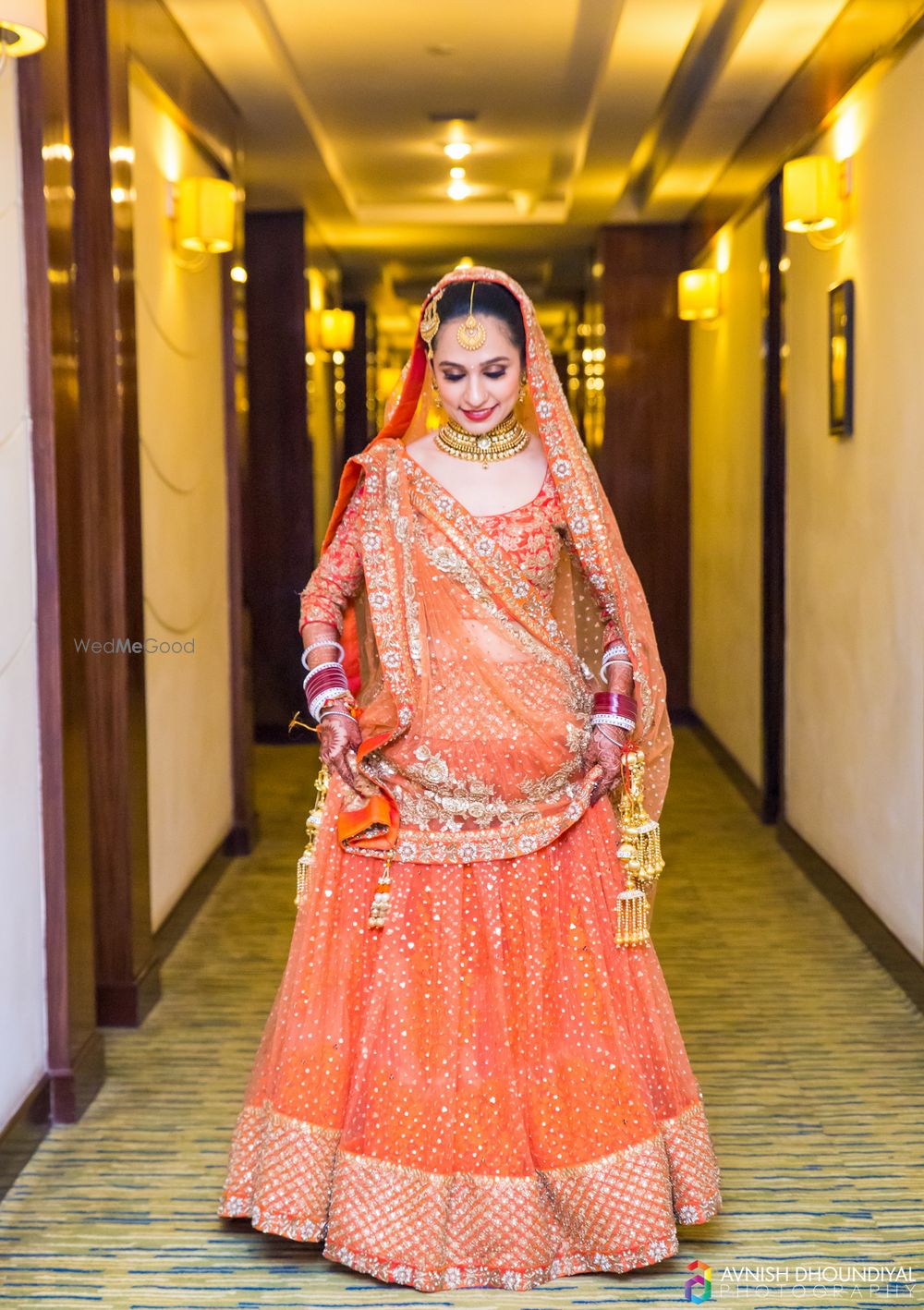 Photo of Orange Glitter Lehenga with Gold Kaleere