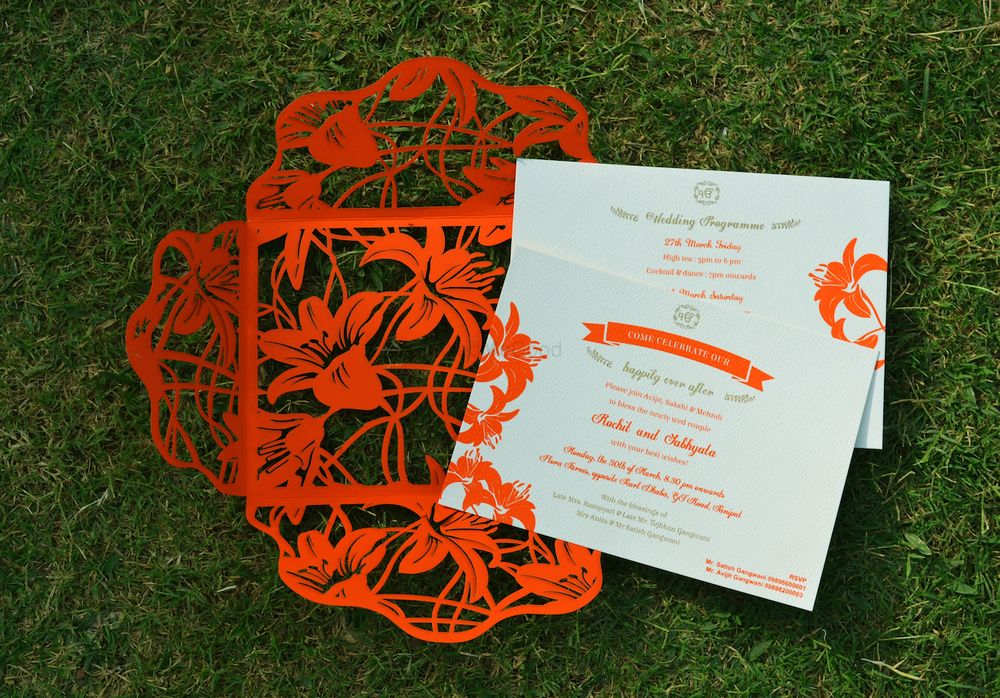 Photo of red laser cut invites