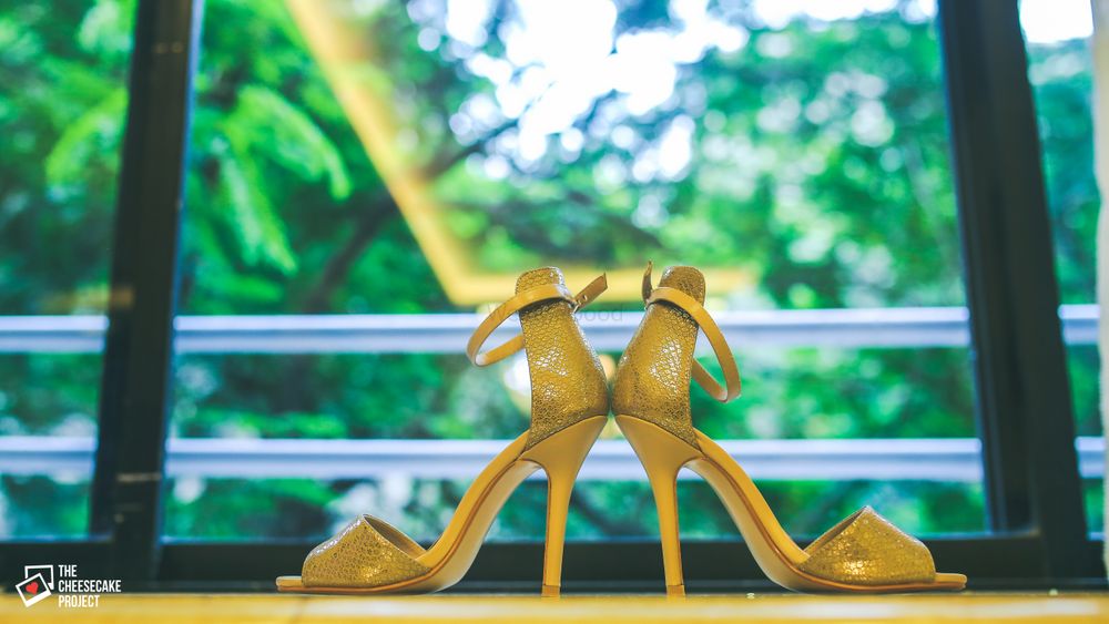 Photo of Wedding heels against window