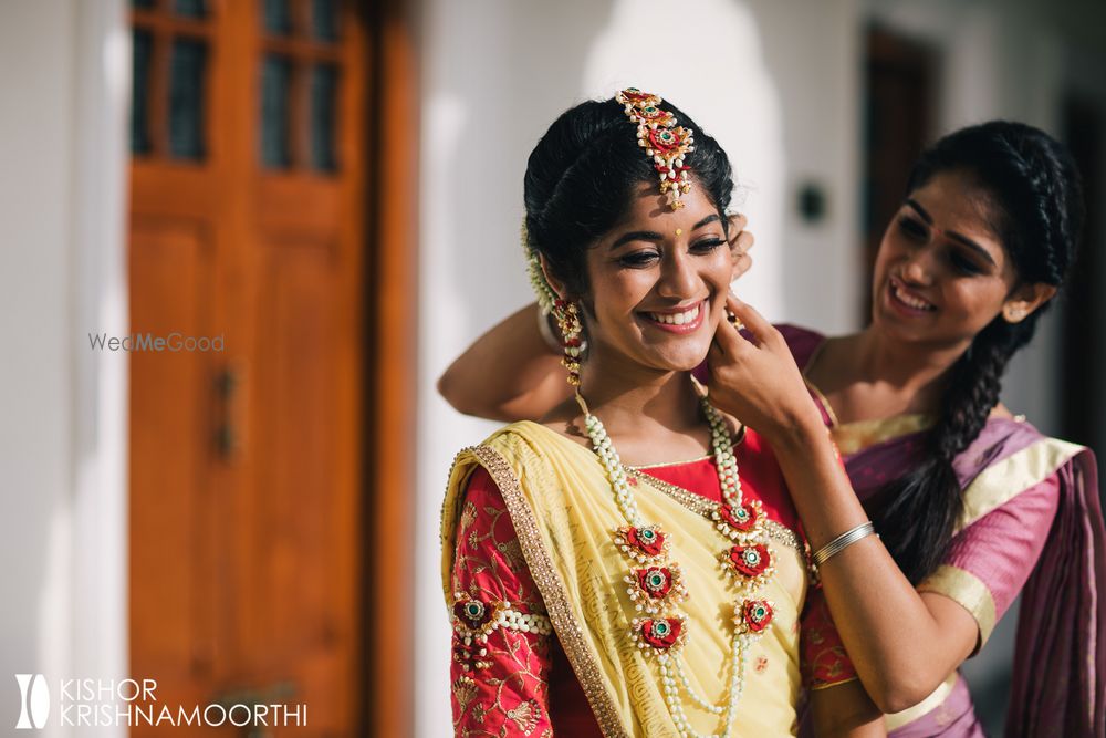 Photo of Sister of the bride getting her ready