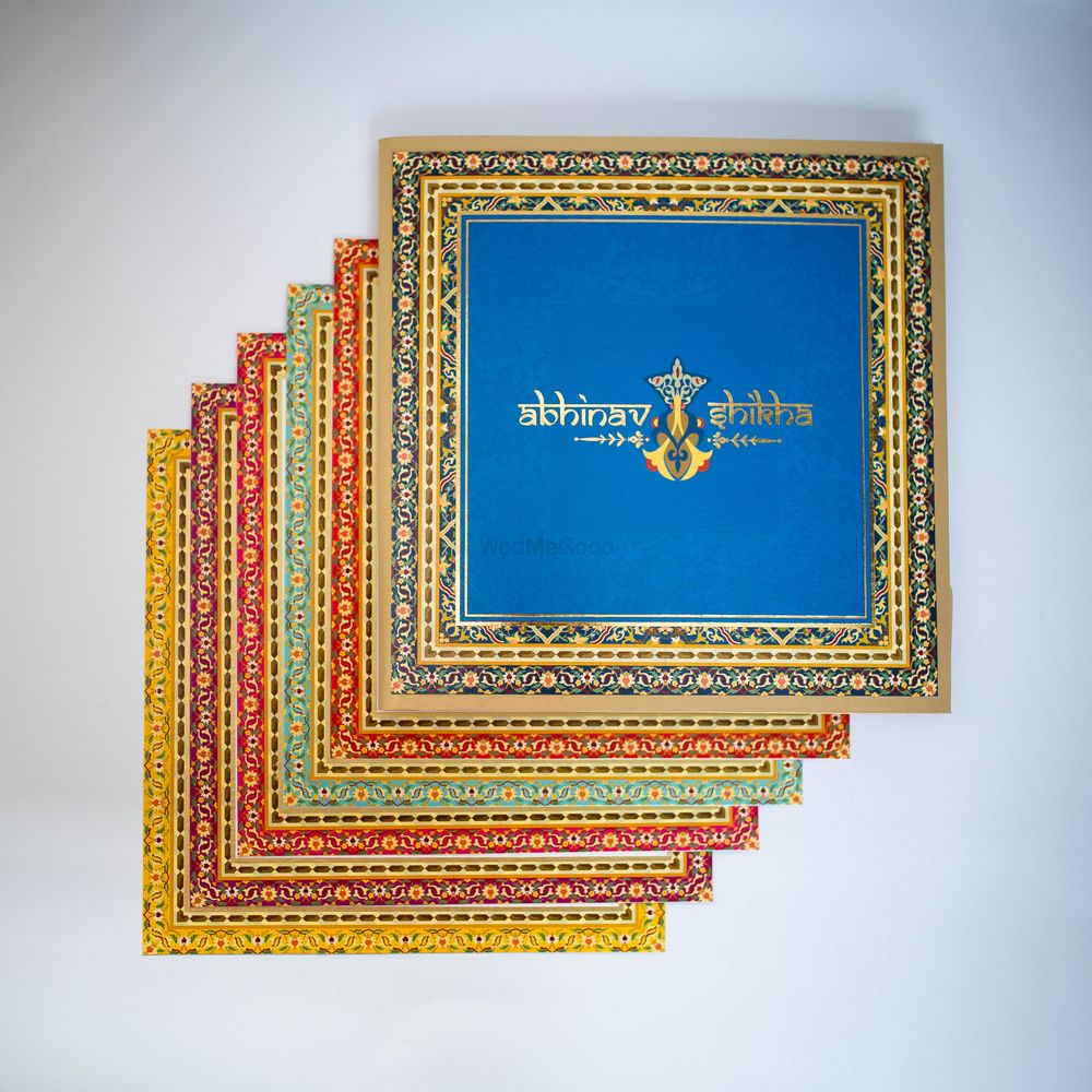 Photo of multicolored square invitation cards