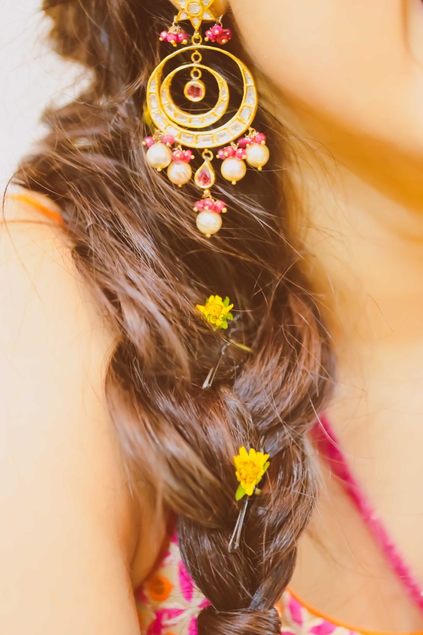 Photo of braid hairstyle with petals