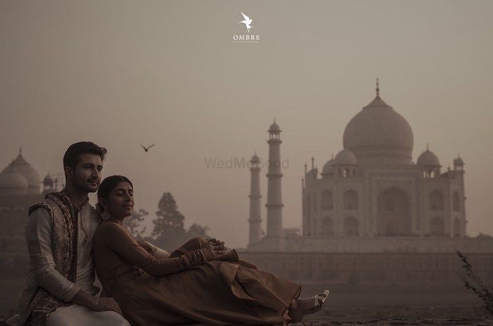 Photo of A pre-wedding shoot of the couple with the Taj Mahal in the background