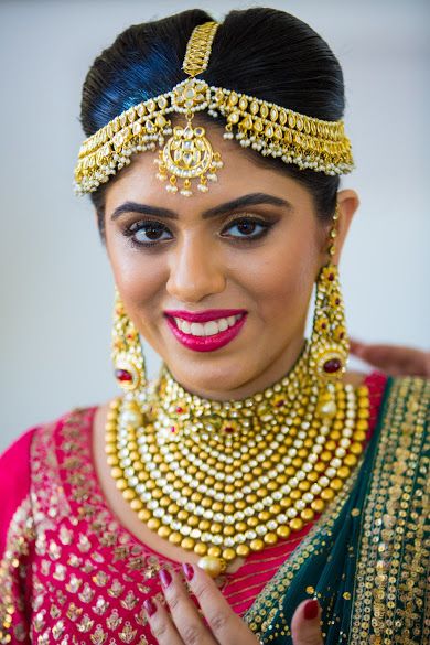 Photo of Bride in Traditional Gold Jhoomer, Choker and Earrings