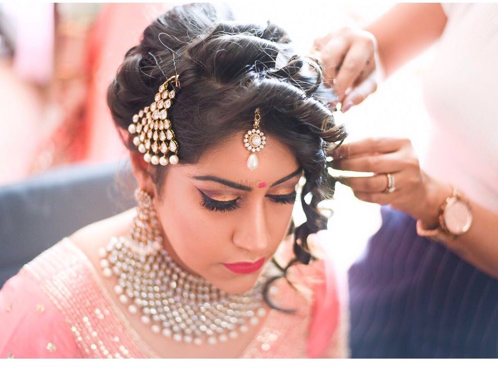 Photo of Bridal Bun with Side Curls and Jhoomer