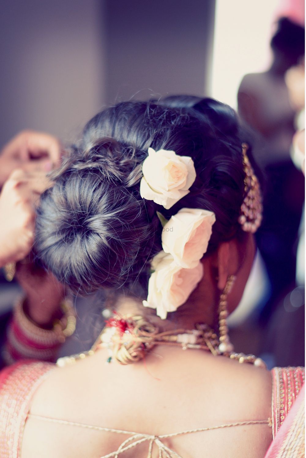 Photo of Bridal Bun with Light Pink Roses
