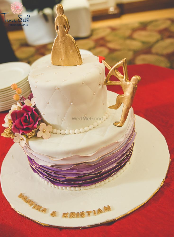 Photo of White and Purple 2 Tier Wedding Cake with Flowers