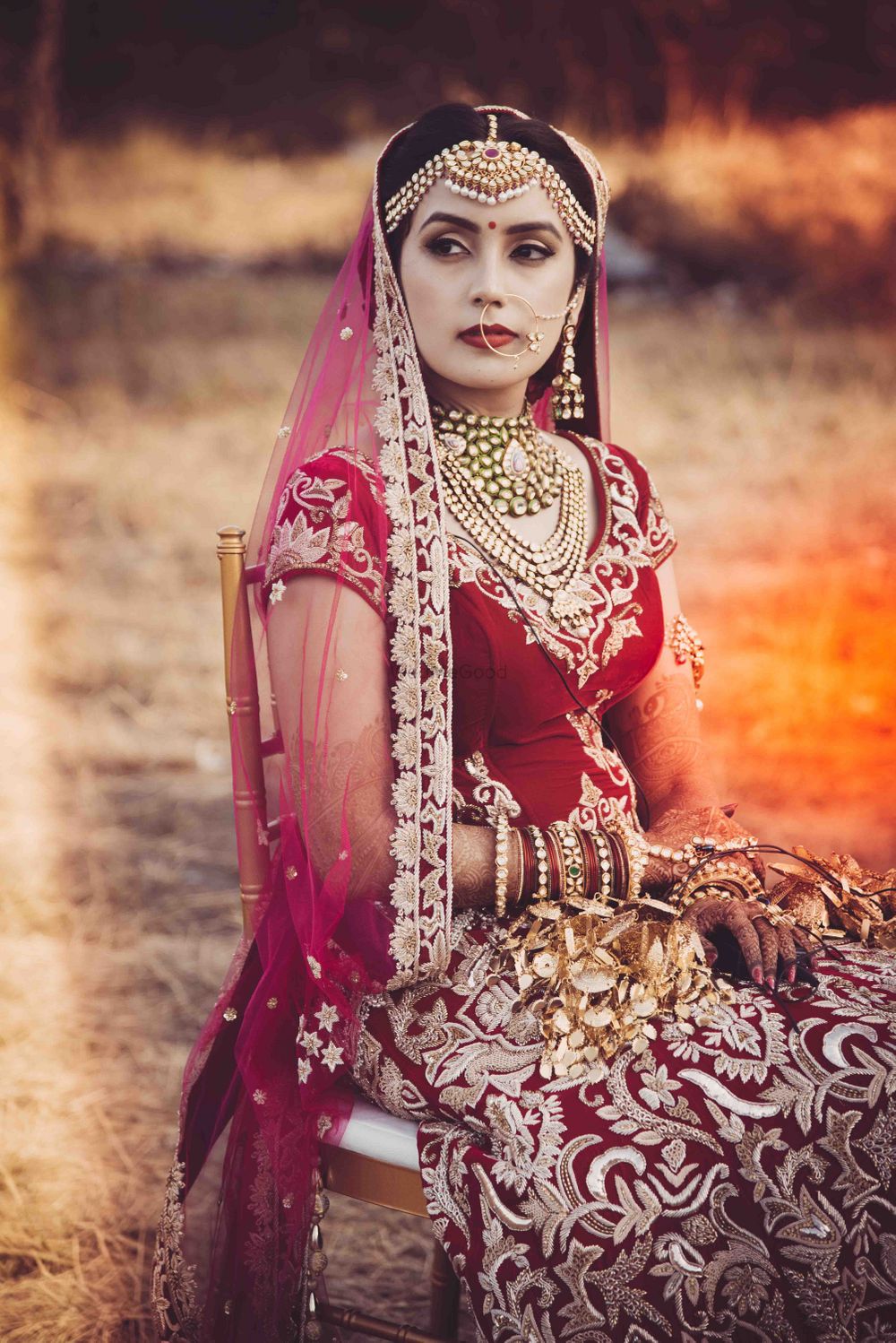 Photo of Bride in Maroon Lehenga and Mathapatti