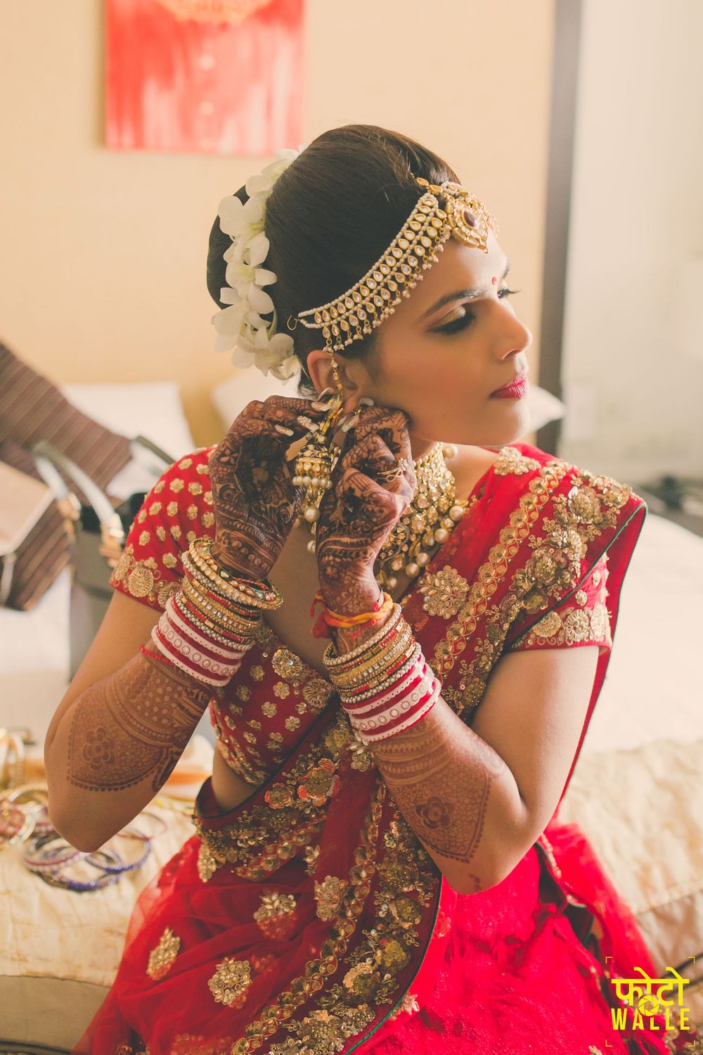 Photo of Bride in Mathapatti wearing Earrings Shot
