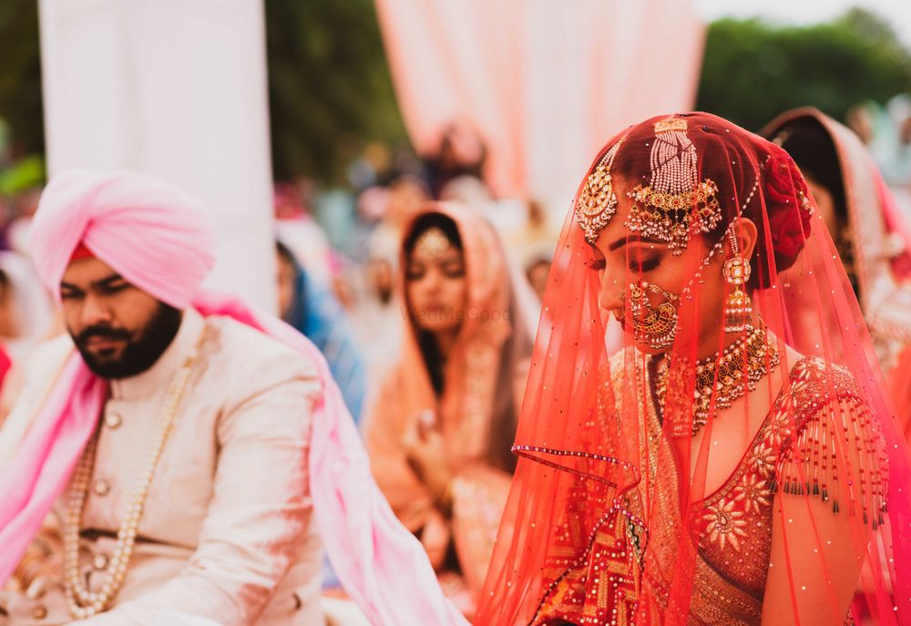 Photo of Sikh bride in warm hued outfit