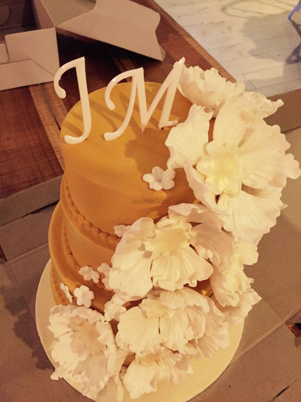 Photo of 3 Tier Wedding Cake with Monograms and Floral Decor