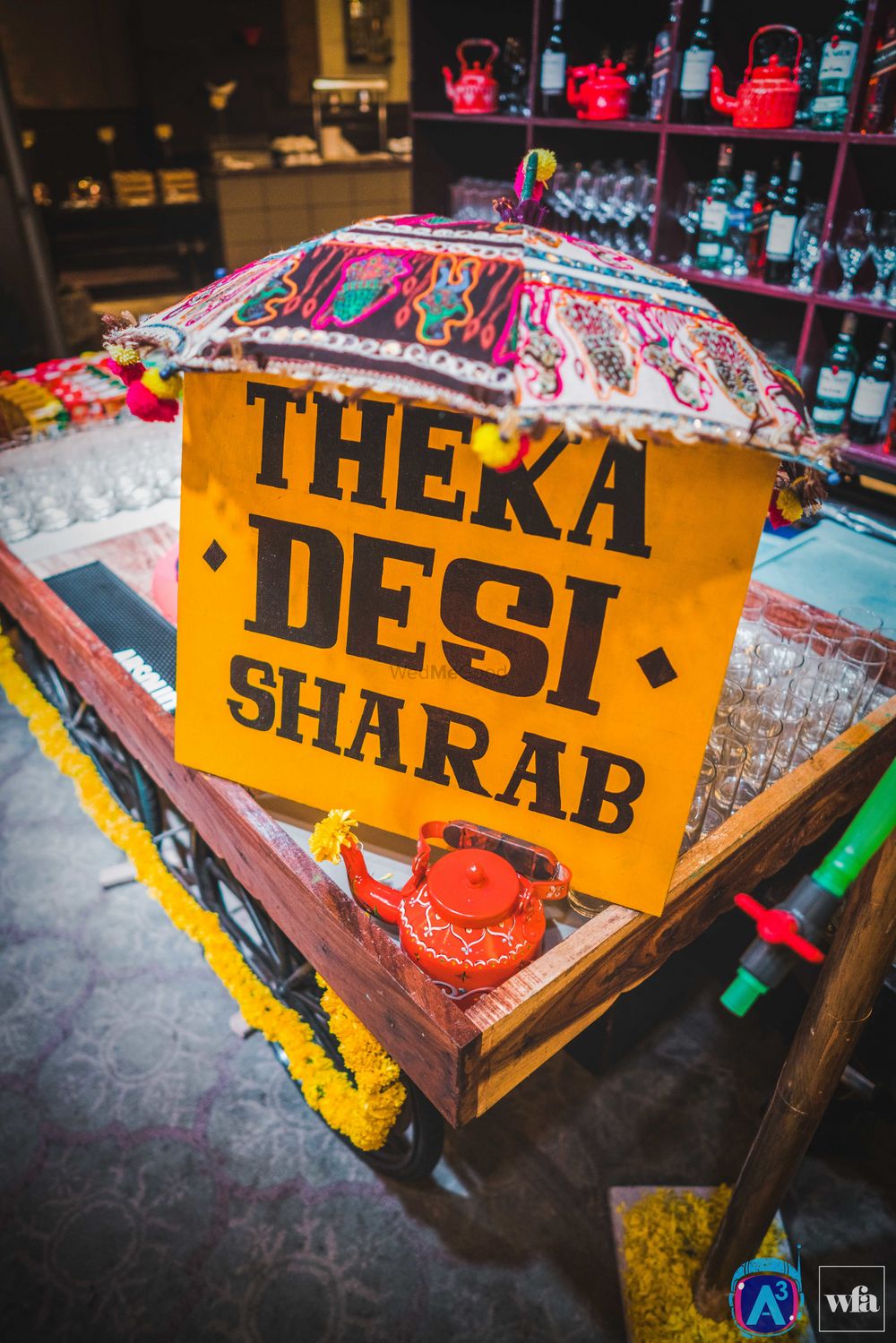 Photo of Bar Desi Theka Board with Kettle and Umbrella