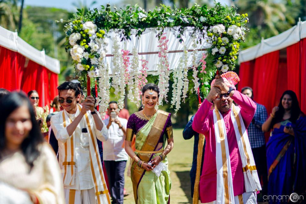 Photo of South Indian Bridal Entry under a phoolon ki chaadar.